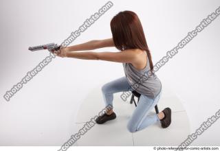16 2020 MOLLY SITTING POSE WITH GUN